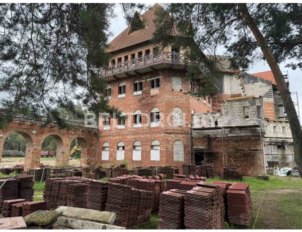 Не завершенный строительством не законсервированный объект: многофункциональный комплекс с объектами социально-культурного и коммунально-бытового назначения, по адресу: Минский р-н, г. Заслав